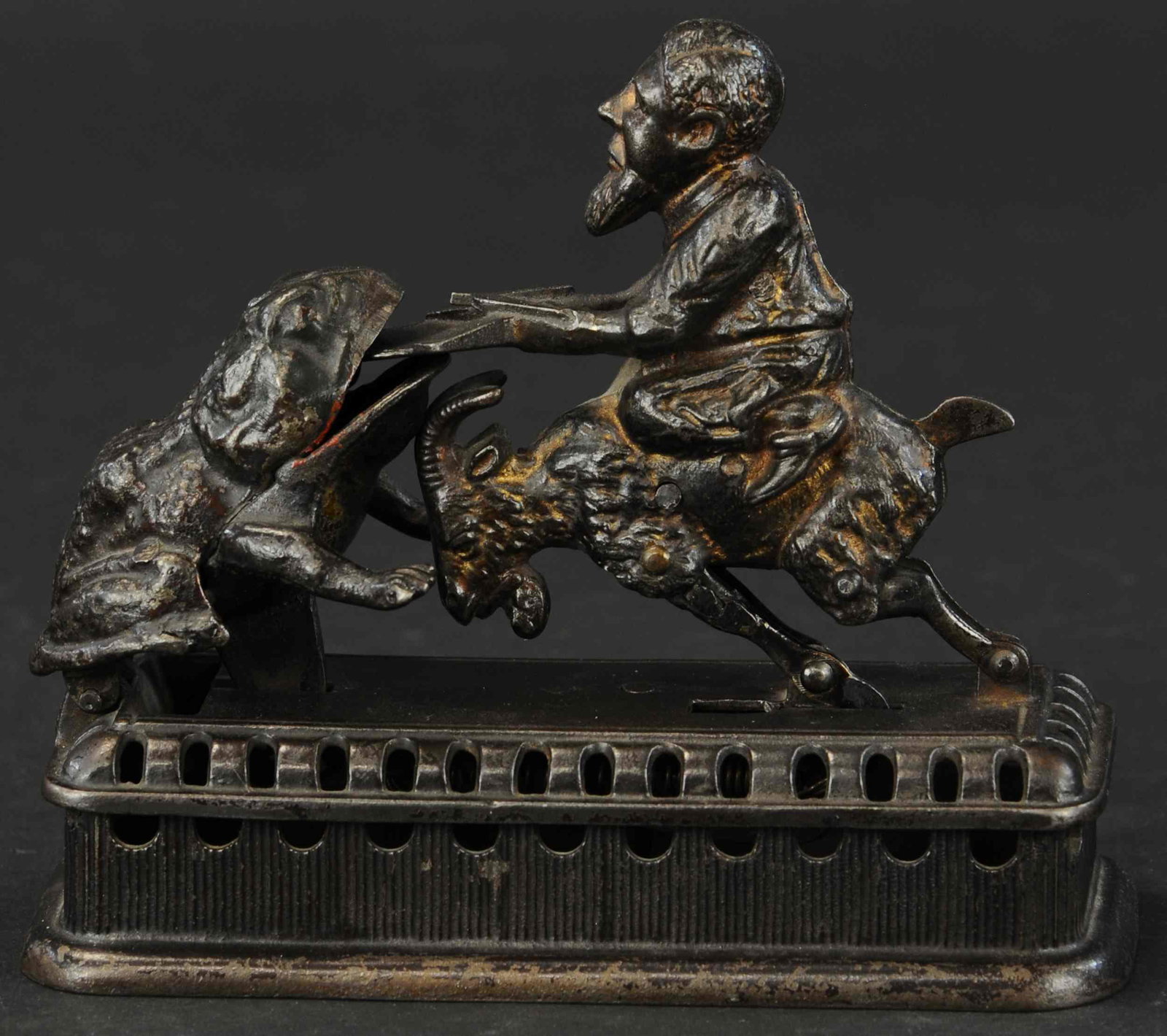 INITIATING BANK SECOND DEGREE MECHANICAL BANK: 242. INITIATING BANK SECOND DEGREE MECHANICAL BANK | Mechanical Novelty Works., the second variation of a familiar bank design, as goat springs forward, coin is deposited into frog's mouth and into ba