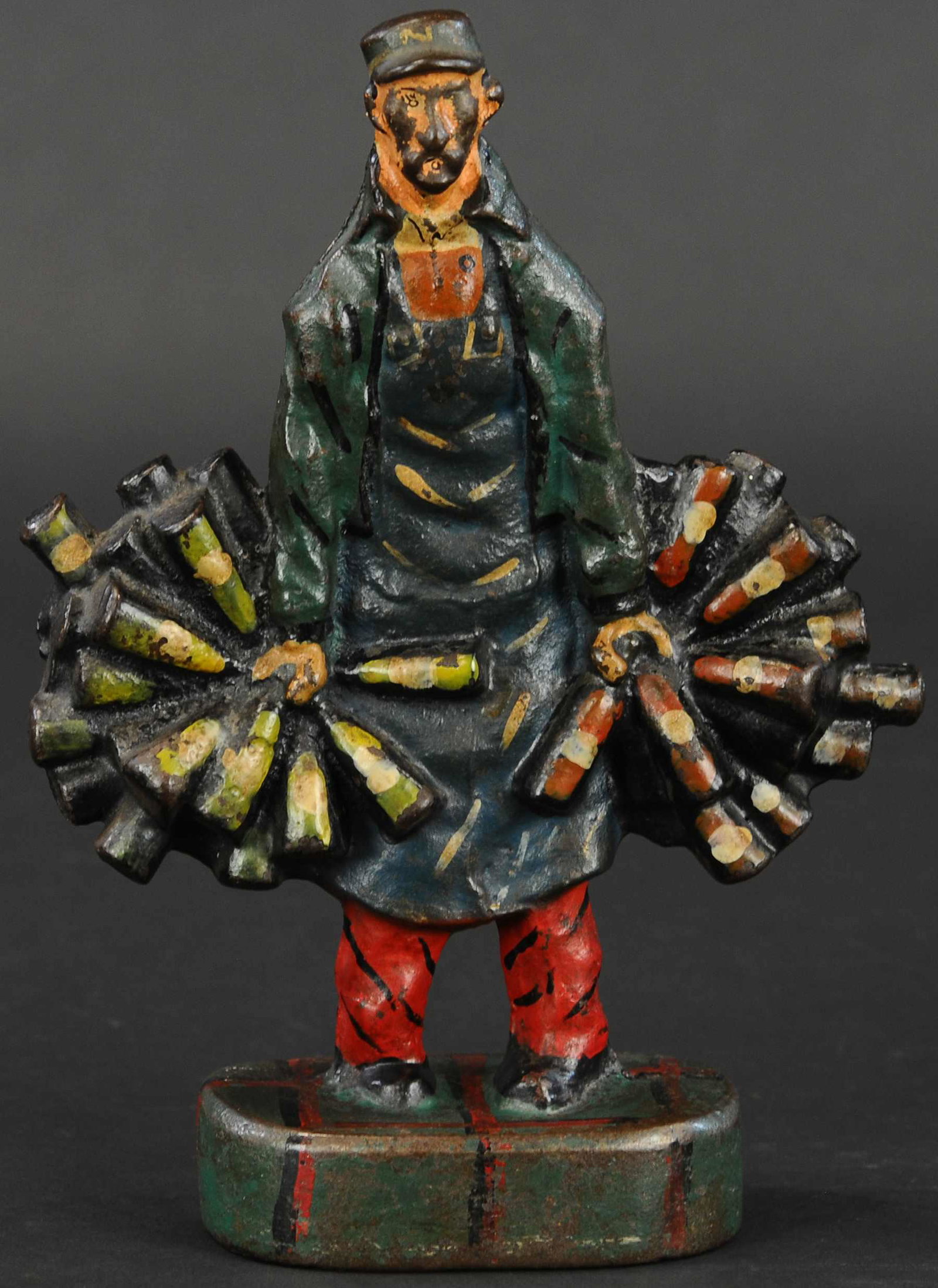 WINE MERCHANT DOORSTOP: 281. WINE MERCHANT DOORSTOP | Rare wonderful design of wine seller with bottles in each hand. Full figured. | 10" h. | Wear on face, otherwise in (Pristine condition). | $1,200 - $1,800