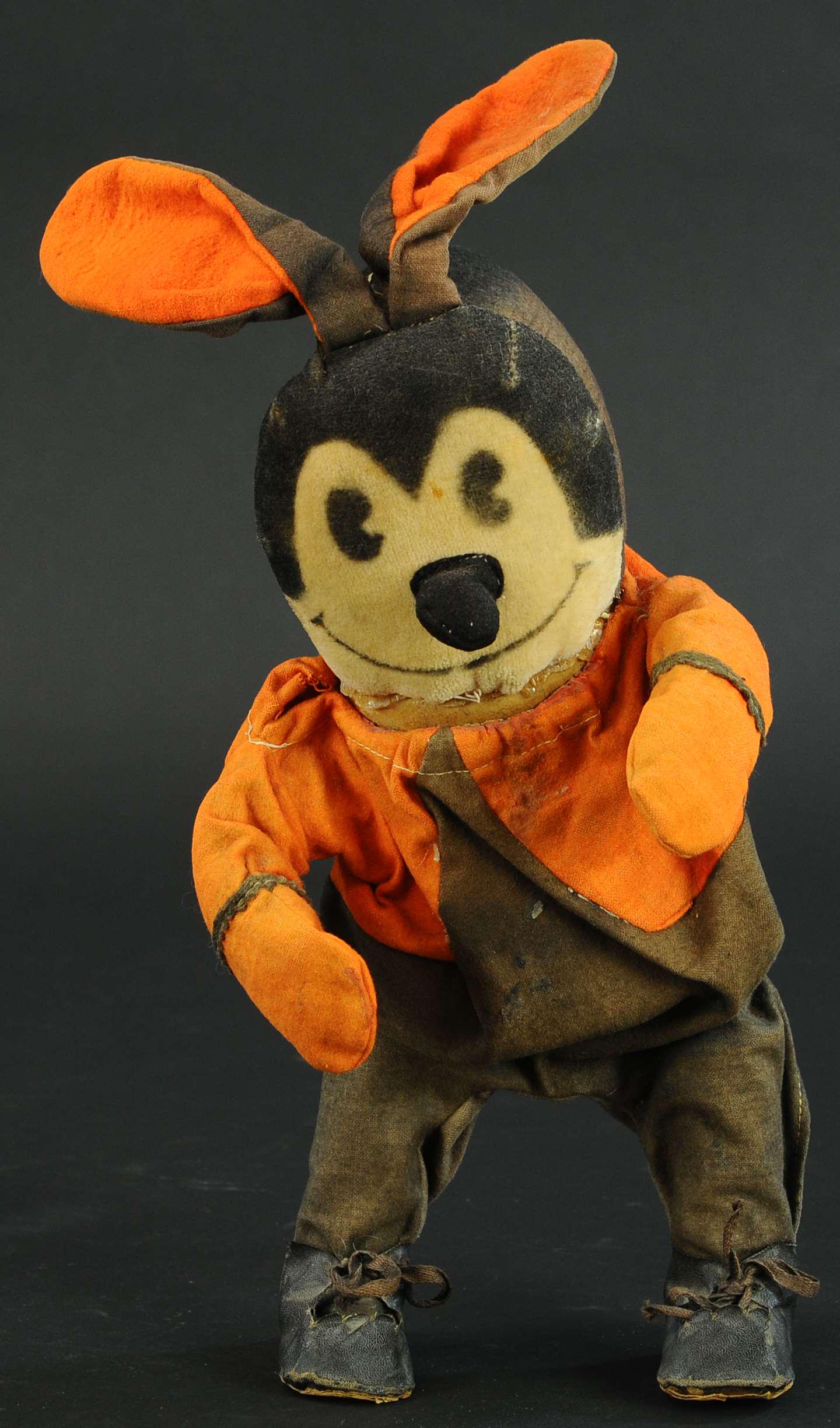 OSWALD THE LUCKY RABBIT WALKER: 404. OSWALD THE LUCKY RABBIT WALKER | 14" h. | Glue around neck area, otherwise in (Very Good Condition) | $400 - $600