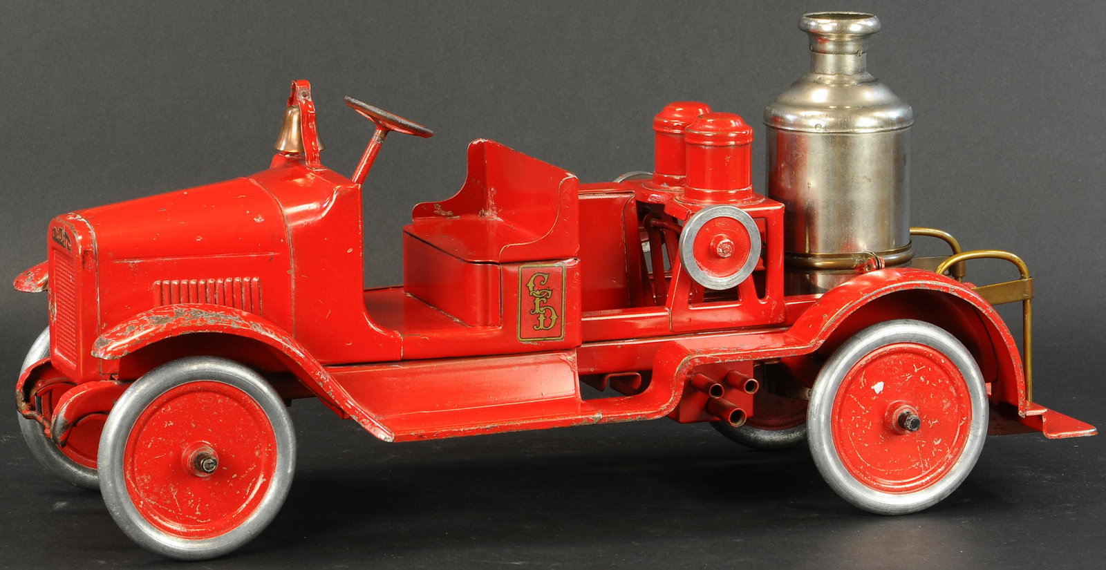 BUDDY L FIRE PUMPER: 542. BUDDY L FIRE PUMPER | Striking red paint on this clean example with playwear primarily to fenders. | 24" l. | As noted, (Excellent Condition) | $1,000 - $1,500