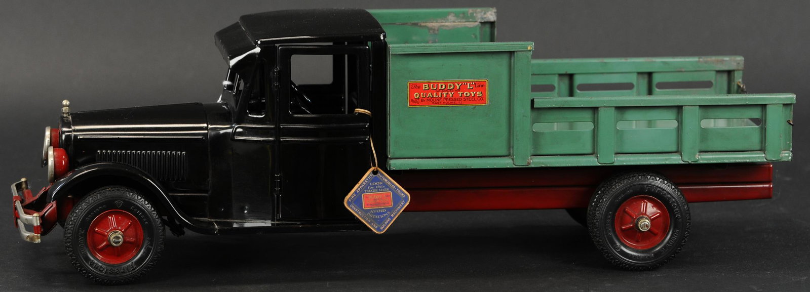 BUDDY L JUNIOR DAIRY DELIVERY TRUCK: 548. BUDDY L JUNIOR DAIRY DELIVERY TRUCK | Wonderful offering of a museum grade conditioned truck, very popular piece from the Junior series trucks by Buddy L. Provenance: Jay Schoedinger Collection. 