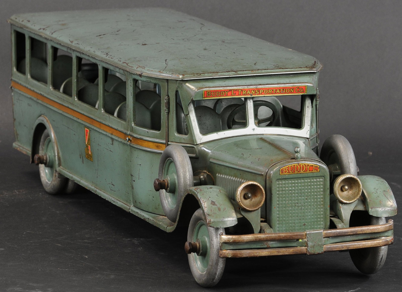 BUDDY L PASSENGER BUS: 624. BUDDY L PASSENGER BUS | One of the more recognizable Buddy L pieces, classic large scale bus with complete bench seating interior. | 29" l. | (Excellent Condition) for this all original toy. | $2