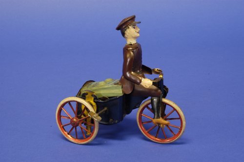 LEHMANN RAD CYCLE MOTORCYCLE: Germany, lithographed and handpainted tin, rider seated holding handle bars, blue body reads ''Rad Cycle,'' spoke wheels, clockwork driven. 5'' long.
