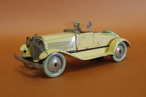 PRE-WAR JAPANESE ROADSTER: Japan, logo uncataloged Y over M, exceedingly rare lithographed tin example, done in yellow body, twoseated figures, celluloid windshield, blue and gold balloon wheels with spare on trunk, nickel plat