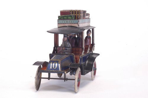 GUNTHERMANN DOUBLE PHAETON: Germany, mid teens version of two bench seat saloon with seated driver and full compliment of passengers, colorful luggage rack, blue body and gold trim, great detail, clockwork mechanism, a scarce ex