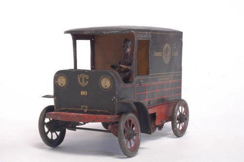 HANS EBERL ''STRAWBRIDGE & CLOTHIER'' DELIVERY VAN: Germany, c. 1920's an early promotional toy for popular Philadelphia department store, lithographed tin, black body, red frame, split door with opening bottom half, seated driver. 7 1/2'' long.