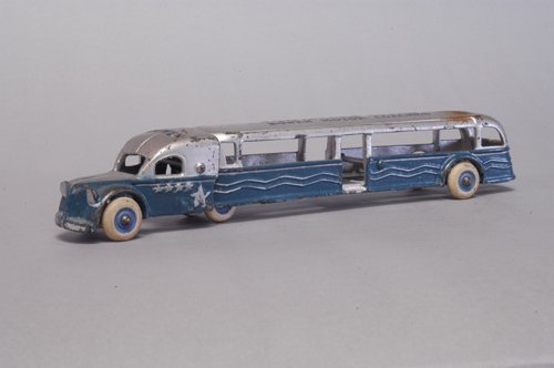 ARCADE 1936 ''TEXAS CENTENNIAL'': C. 1936, cast iron, a very scarce bus made for the Centennial for Bowen Motor Coaches, which is stenciled on roof of cab and trailer, embossed stars for state of Texas, wave lines embossed on trailer,