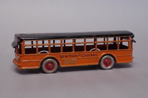 DENT FACTORY SAMPLE TWIN MOTOR COACH: Cast iron, embossed ''New York - Chicago'' on sides, painted in orange body, black roof, nickel disc wheels, painted centers, well detailed molding, contains Dent Hardware Co. sample tag No. 1648, bod