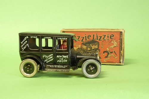 STRAUSS BOXED ''DIZZIE LIZZIE'': Lithographed tin, great action involves hood of auto seemingly falling apart when clockwork activated, black auto, extensive wording on body, disc wheels, roof reads ''Leaping Lena.'' 8'' long.