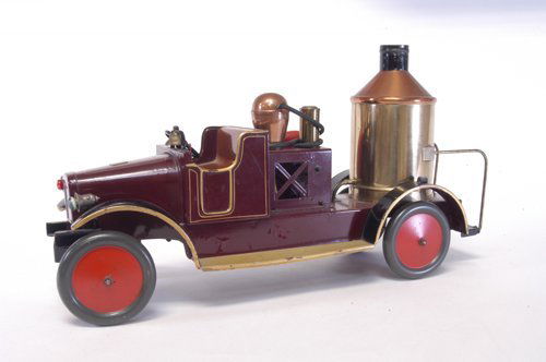 BING FIRE PUMPER: Germany, another scarce large scale series fire truck, done in deep brown, open bench seat, frame contains brass boiler and wiffle, side wheel allows articulation and pumping from hose, quite detailed