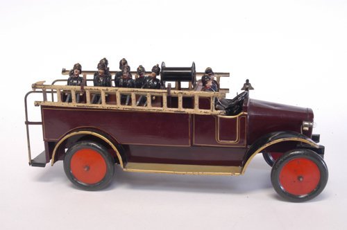 BING FIRE LADDER TRUCK: Germany, large scale series, impressive open bench service bed contains hose reel, side ladders, and outfitted with hand-painted wood jointed figures, truck painted in deep brown, electric lights. 21'
