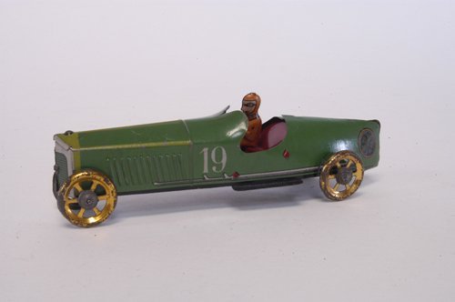 INGAP RACE CAR PENNY TOY: Italy, lithographed tin, done in green body, seated driver, gold finish spoke wheels. 6 1/2'' long.
