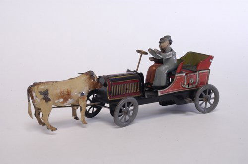 HANS EBERL ''CONFRONTATION CAR'': Germany, c. 1912, incredible design allows bull to strike radiator when clockwork is activated, open auto features two figures, one appropriately has extended arms as if motioning to animal. Book exam