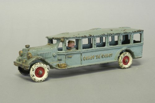 HUBLEY ''COAST TO COAST'' BUS: C. late 1920's, cast iron, painted blue overall, embossed ''Coast to Coast'' on sides, cast driver and horn on side, disc wheels painted in white, red centers, middle of three sizes in series. 9 3/4''