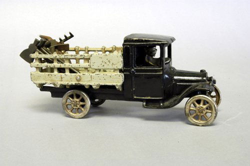 ARCADE CHEVROLET UTILITY EXPRESS TRUCK: C. 1920's, cast iron, enclosed black cab and frame, stake side body, nickel driver, this series is relatively scarce. 9'' long.