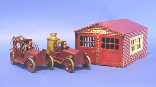 FIRE ENGINE HOUSE WITH PUMPER AND LADDER TRUCK: Attributed to Republic features a lithographed tin Engine house with opening front bay doors, contains early pressed steel ladder truck and pumper, both painted in red, gold stripes, seated figures, f