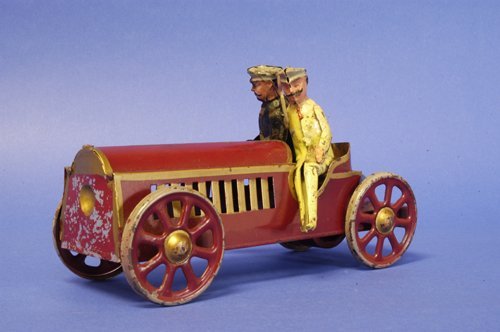 EARLY SPORT RACER: Possibly Schieble, early 1900's, pressed steel, painted in red with gold striping, two hand-painted figures added for great visual, spoke wheels, hill climber friction driven. 11'' long.