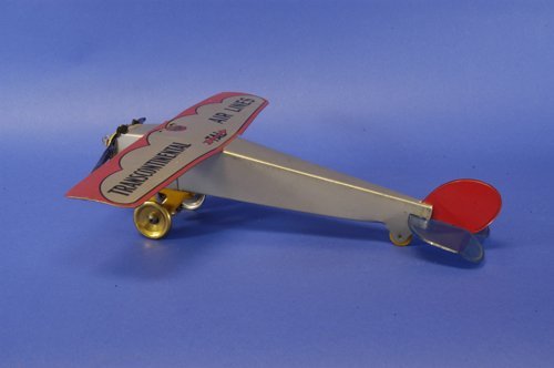 GIRARD ''TRANSCONTINENTAL'' AIRPLANE: Lithographed tin, silver fuselage with red trimmed wing, reads ''Transcontinental Airlines,'' friction driven, red and blue tail fin section. 17'' wingspan.