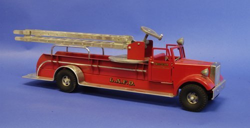 SMITH MILLER BOXED AERIAL LADDER: This is a 1954 M.I.C. model with Smith Miller box and labels, old store stock, done in red overall, fire engine contains hand lever to raise aerial ladder, polished aluminum running boards, well detai