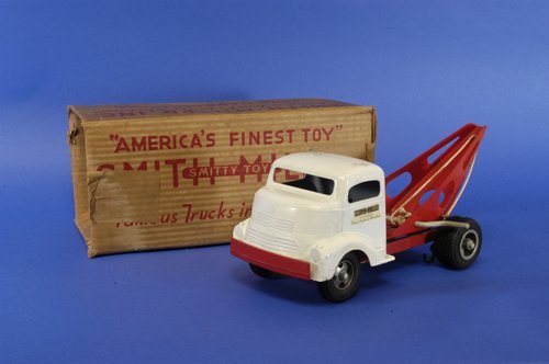 SMITH MILLER BOXED GMC WRECKER: c. 1948, old store stock, roof still marked $6.98, white cab with red pressed steel crane, rubber tires, dual on rear, could use cleaning, restoring to new again. 14 1/2'' long.