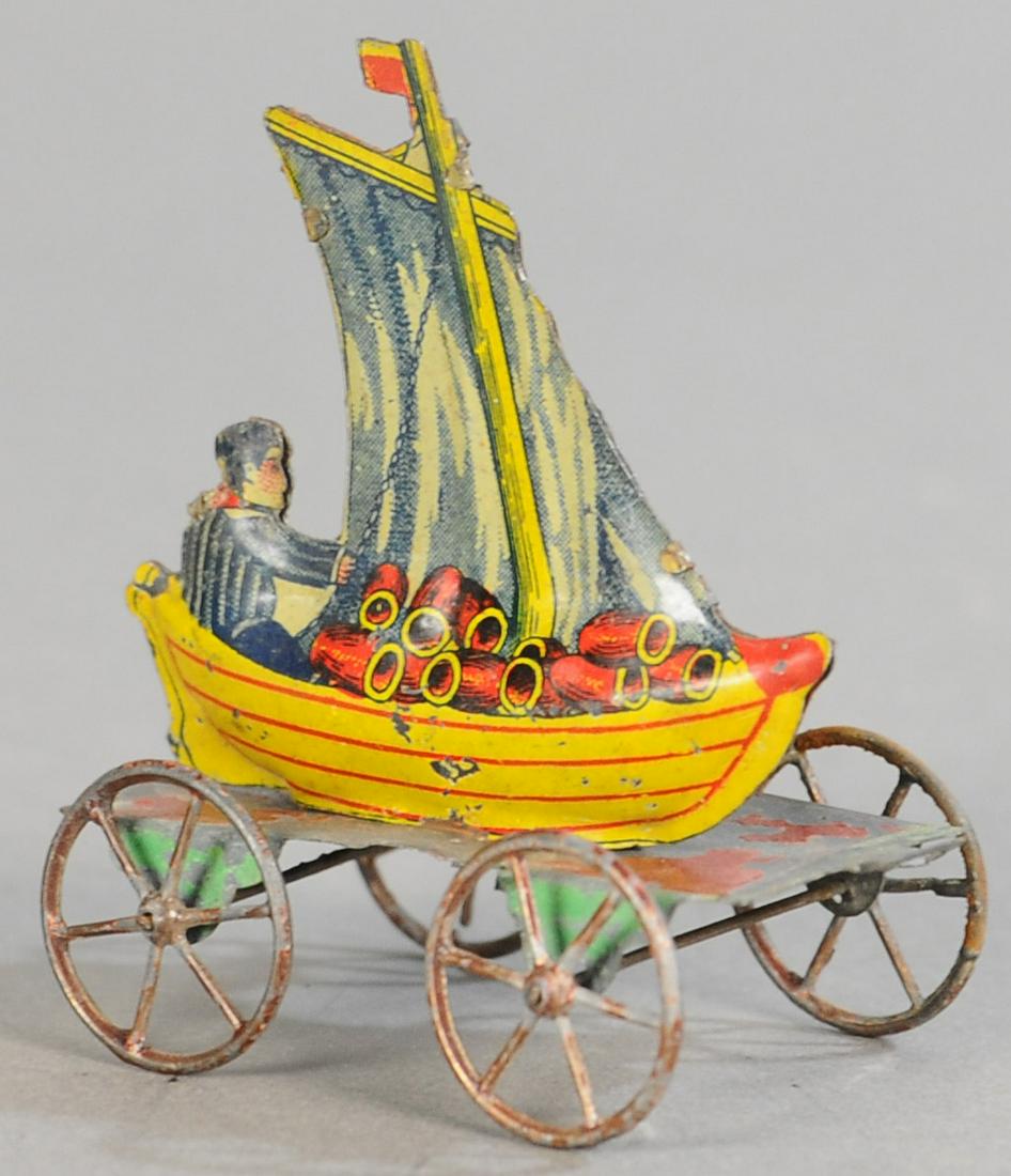 JAPANESE SAILBOAT PENNY TOY: 62. JAPANESE SAILBOAT PENNY TOY | 3" h. | All Original Condition. | $150 - $300