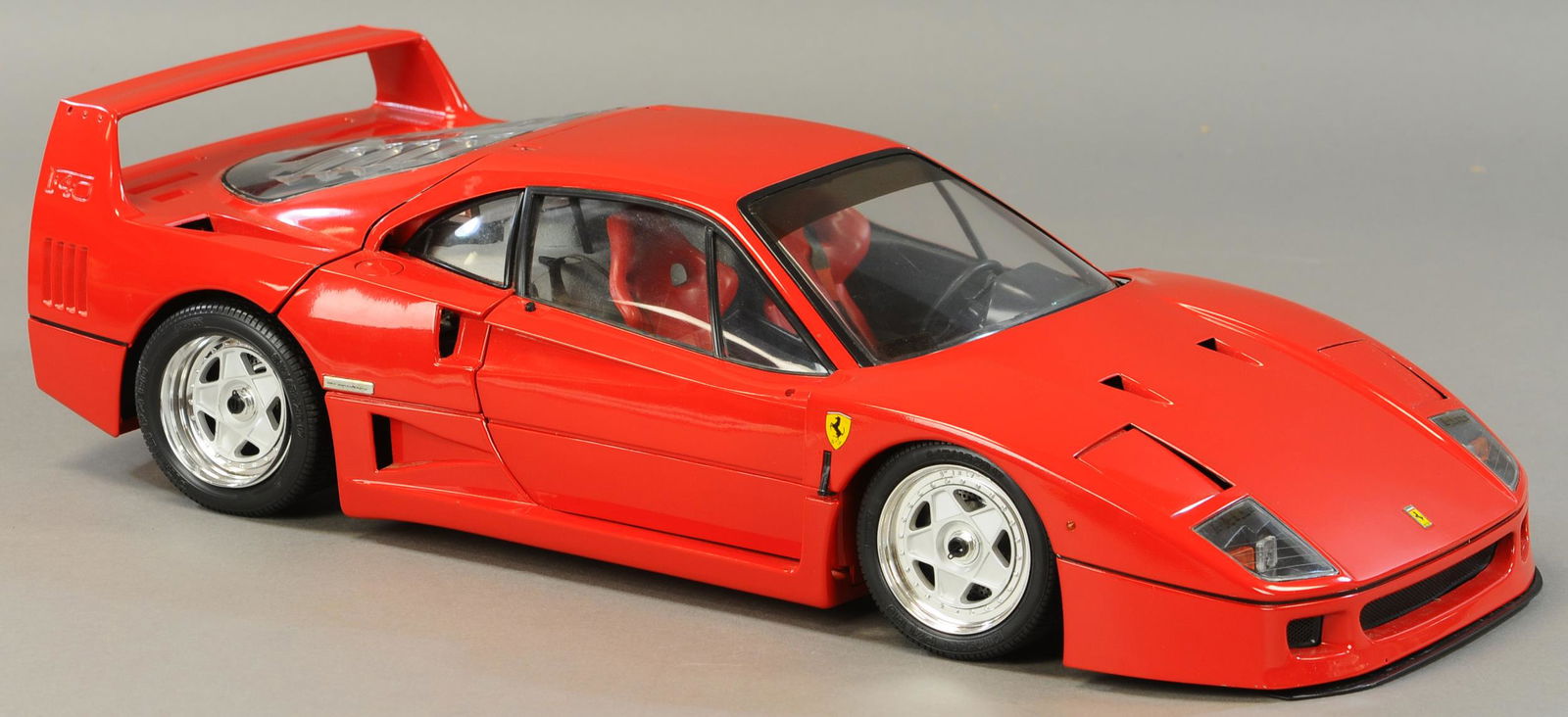 R. MAROSSI ITALIAN FERRARI SCALE MODEL: 91. R. MAROSSI ITALIAN FERRARI SCALE MODEL | Made true to scale with hood locks, door locks, gear shift, engine, etc. | 21" l. | Minor splits to plastic under front lip, otherwise appears to be in All