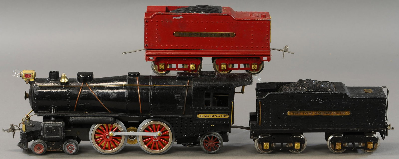 IVES 1134 LOCOMOTIVE AND TENDER: 236. IVES 1134 LOCOMOTIVE AND TENDER | Standard gauge, electric. | Loco & tender 23" l. | Cowcatcher added in place of broken original, Loco window frame cracked, Loco drive wheels and side rods repla