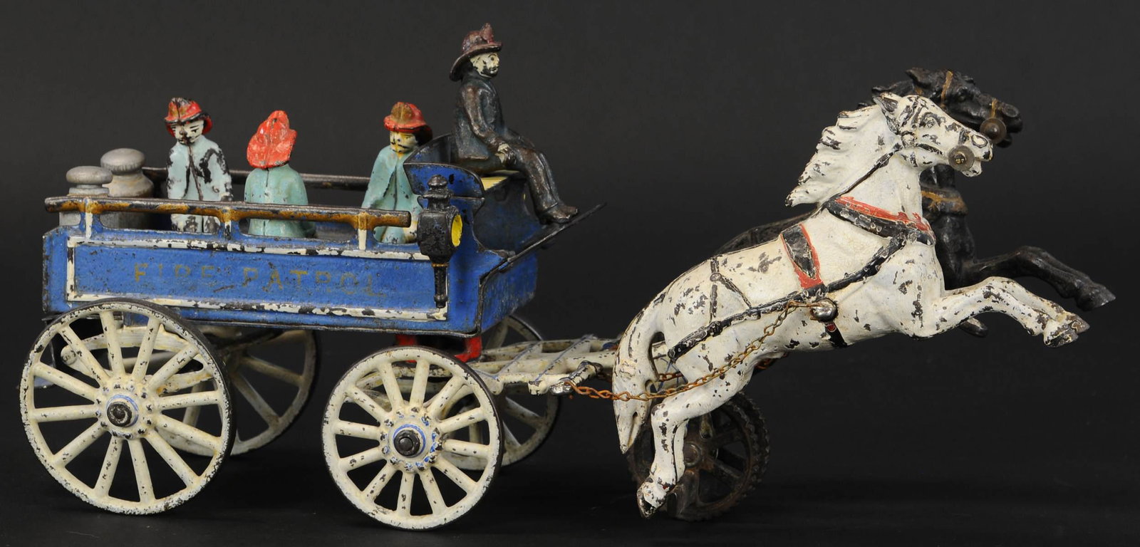 PRATT & LETCHWORTH FIRE PATROL: 130. PRATT & LETCHWORTH FIRE PATROL | Very attractive with wagon painted blue, very hard to find with all authentic pieces, four original passenger figures (one is seated at reins), white wheels and h