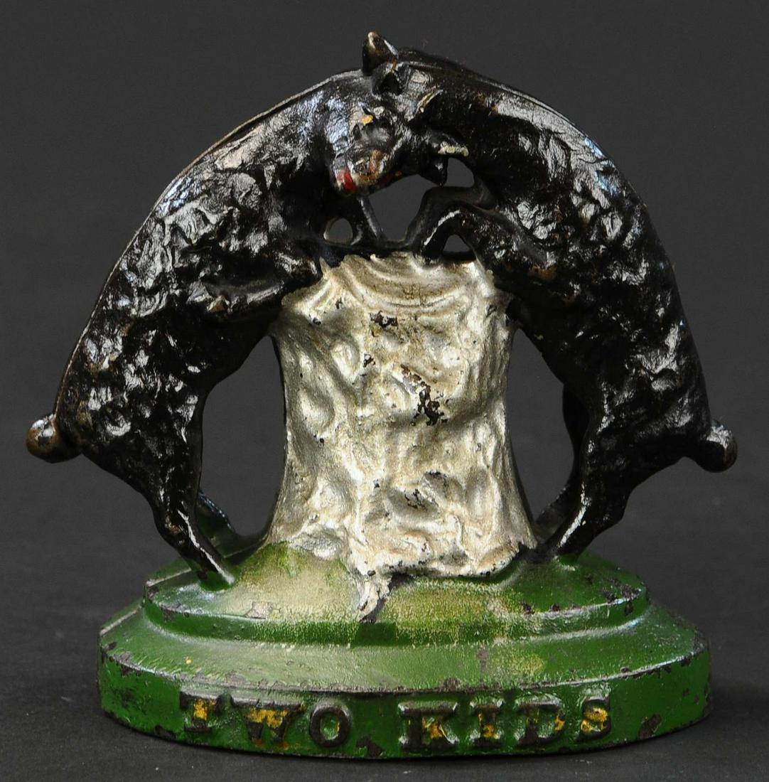 TWO KIDS STILL BANK: 204. TWO KIDS STILL BANK | Attributed to Harper, nicely painted all original example. Provenance: The Schroeder Collection. | 5" h. | Small chip to base edge at seam, otherwise paint in (Excellent Con