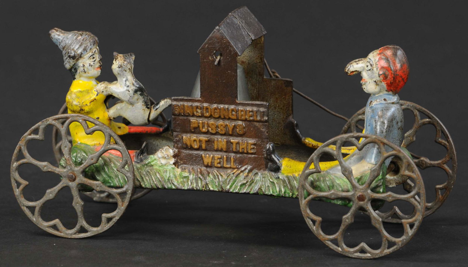 DING DONG BELL TOY: 242. DING DONG BELL TOY | Gong Bell, raised letters on each side of well read "Ding Dong Bell Pussy's not in the Well," a classic story book theme toy. Provenance: The Schroeder Collection. | 9.25" l.