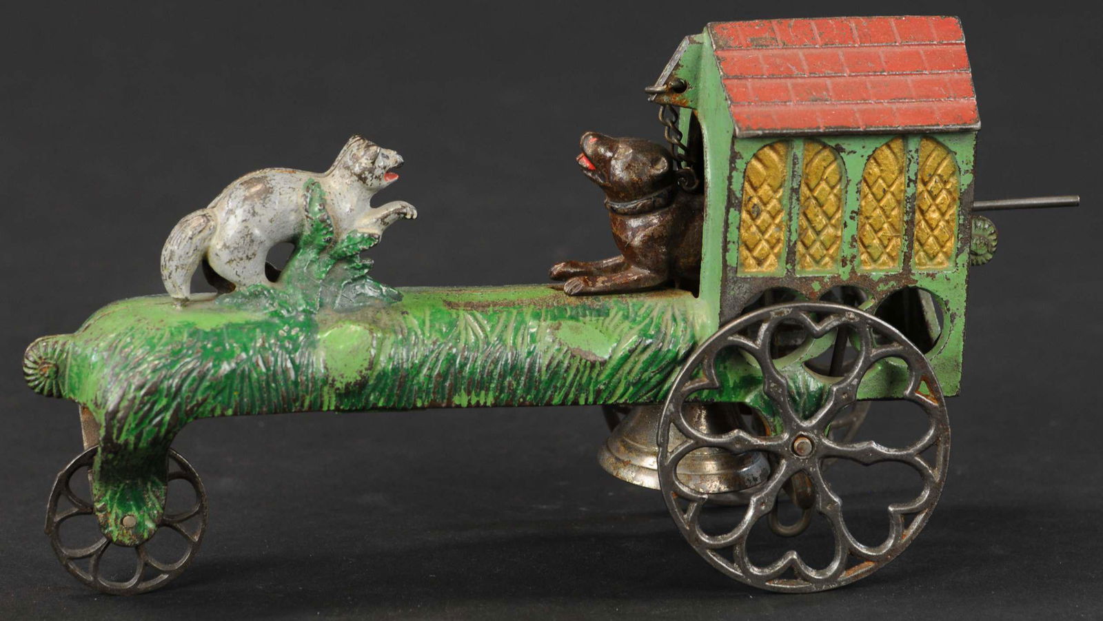 GONG BELL CAT AND DOG BELL TOY: 244. GONG BELL CAT AND DOG BELL TOY | Attractive green sided building accents the detailed casting, circa 1872, articulated action causes dog to emerge from dog house as if keeping cat away while bell