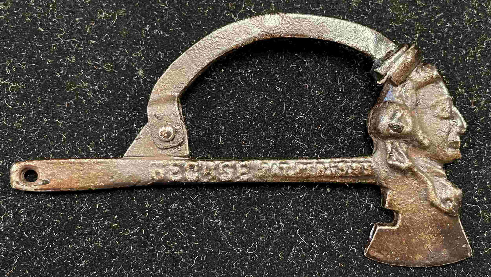 GEORGE WASHINGTON AXE CAP BOMB: 259. GEORGE WASHINGTON AXE CAP BOMB | Striking the axe on a hard surface will bring down arm to fire the cap. Provenance: The Schroeder Collection. | 4" l. | (Excellent Condition) | $200 - $400