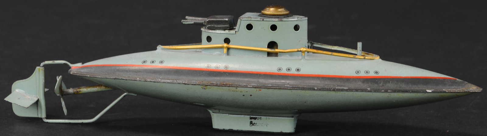 ARNOLD SUBMARINE: 358. ARNOLD SUBMARINE | Catalog No. 2003, circa 1920's, hand painted tin clockwork diving submarine. Provenance: The Schroeder Collection. | 11" l. | (Pristine Condition) | $400 - $700