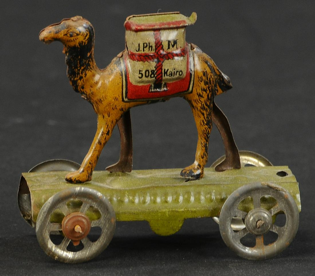 MEIER CAMEL CANDY CONTAINER PENNY TOY: 398. MEIER CAMEL CANDY CONTAINER PENNY TOY | Provenance: The Schroeder Collection. | 3" l. | (Excellent Condition) | $300 - $400