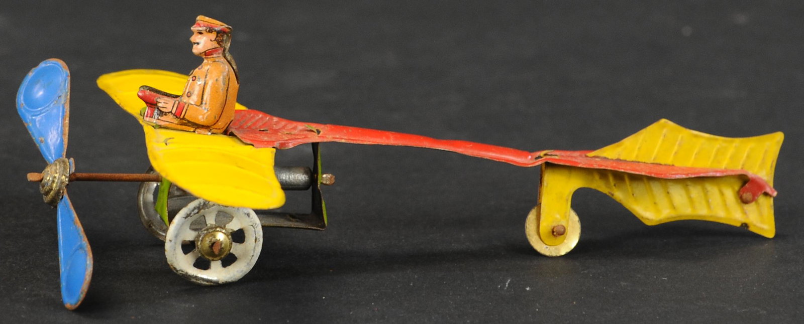DISTLER AIRPLANE PENNY TOY: 506. DISTLER AIRPLANE PENNY TOY | Provenance: The Schroeder Collection. | 5.5" l. | (Excellent Condition) | $600 - $900