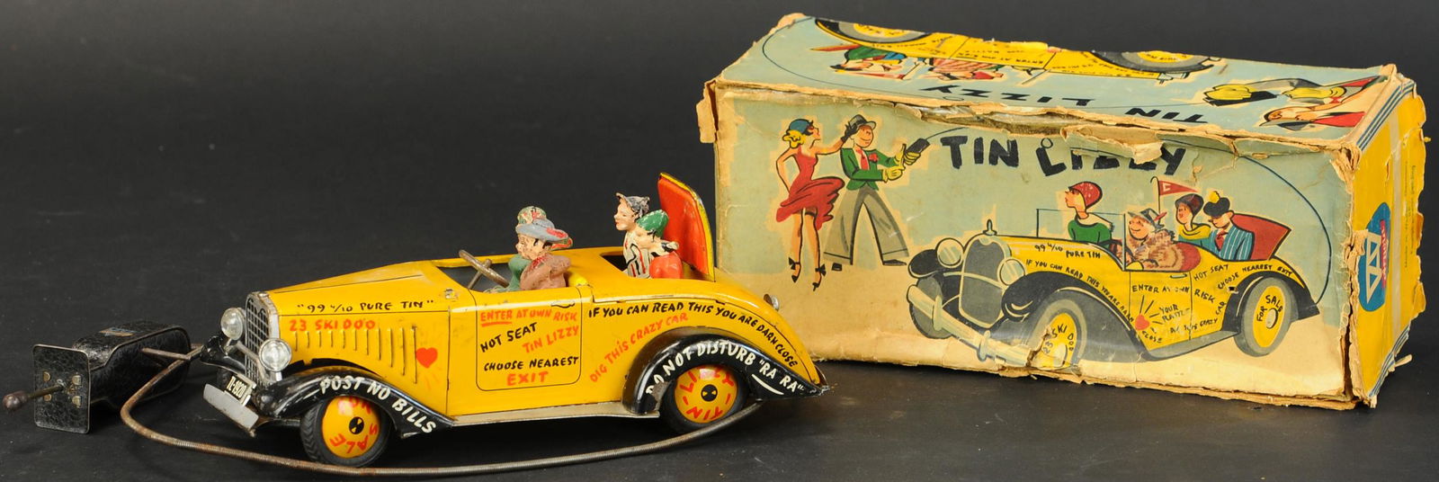 BOXED ARNOLD TIN LIZZY CAR: 566. BOXED ARNOLD TIN LIZZY CAR | Colorful convertible auto contains four composition figures, hand control activated forward motion and steering, graphic lettering featured on body of car. Provenance