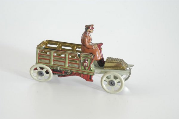 MEIER DELIVERY TRUCK PENNY TOY: Germany, great color scheme, lithographed tin open stake truck with seated driver, detail to chain drive, spoke wheels. 3 1/4" l.
