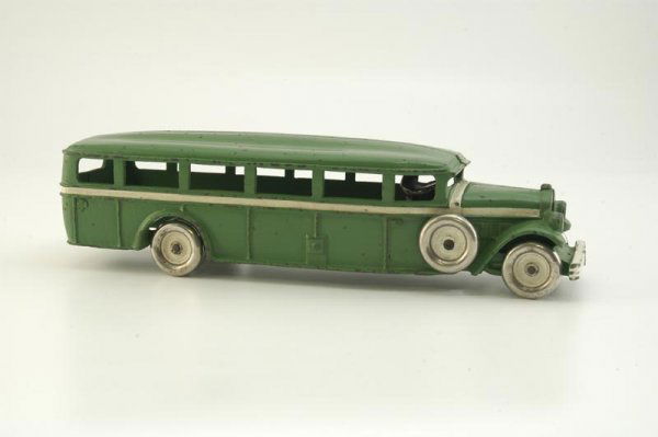 ARCADE "WHITE 6" BUS: c. 1928, very scarce cast iron example, painted in green overall with white side band and hood highlights, front grille embossed "White 6", nickel disc wheels and side mount spares, seated nickel driv