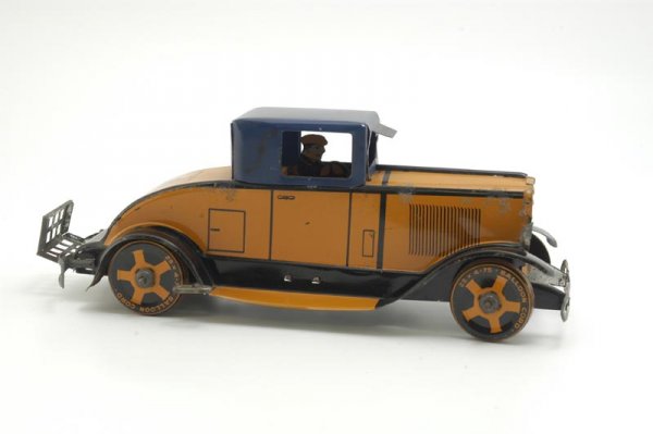 MARX ROADSTER: Lithographed tin, orange body, blue roof, black fenders, foldable luggage rack, clockwork driven. 11 1/4" l.