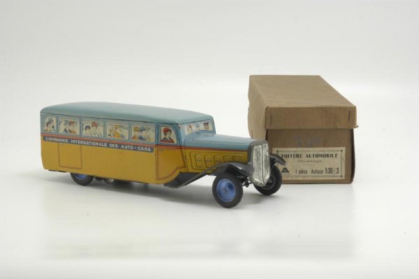 BOXED FRENCH TOURING BUS: M&L, France, very colorful tin lithography, depicts passengers seated at window, curved fenders, key wind spring barrel mechanism, rubber tires, disc wheels are blue spirit painted. 13" l.