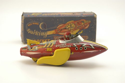 BOXED REX MARS FIGHTER SHIP: Louis Marx, rare, made in Great Britain example, clockwork operation, bright, strong paint and graphics, armed figure in cockpit. 11 3/4" l.