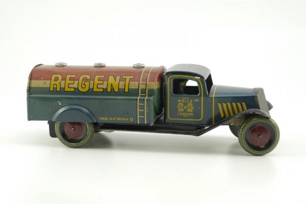 WELLS-O-LONDON "REGENT" OIL TANKER: England, c. 1930's, colorful tank truck done in tin lithography, body done in red, white and blue, enclosed blue cab with nickel plated grille, keywind mechanism. 10" l.