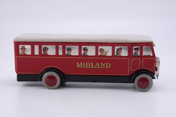 CHAD VALLEY "MIDLAND" BUS: c. 1940's, England, lithographed tin, done in bright red body, white roof, and features mirrored finish windows with seated passengers, clockwork driven, destination board reads, "Birmingham." 11 3/4"