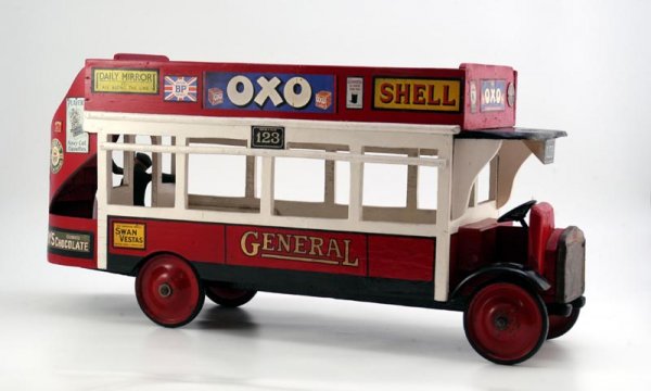 TRIANG "GENERAL" DOUBLE DECKER BUS: Large and impressive detail, a distinctive London city bus with full rear stairs and advertising decals on sides, metal disc wheels, interior and upper deck seating, wood body. 29" l.