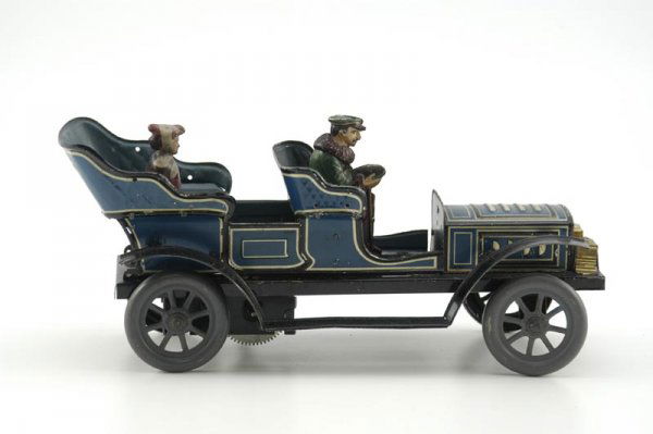 HANS EBERL TOURING AUTO: Germany, c. 1920's, open four seater done in blue tin lithography, features seated driver and passenger, gold finished head lamps, embossed seating, clockwork driven, very desirable size, tabs at side