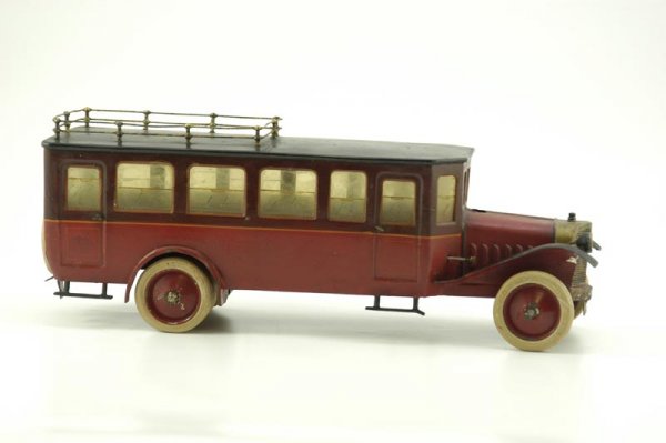 MARKLIN BUS: Germany, a classic toy in well built fashion, long body interurban bus has celluloid windows throughout, mesh grille, rubber tires, clockwork activated through bonnet, wire roof rack, steps on both si