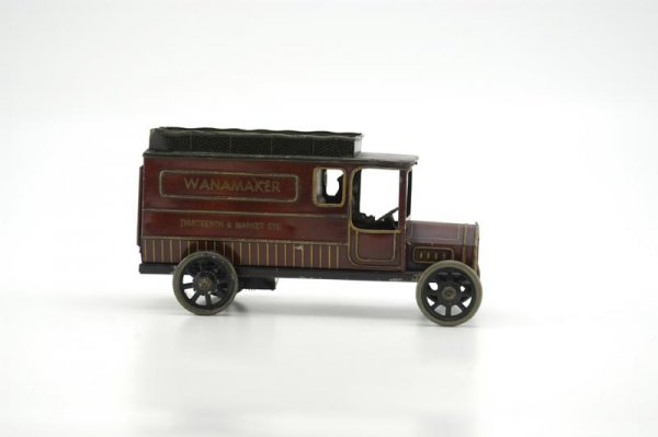 BING "WANAMAKER" DELIVERY VAN: Germany, c. 1920's, lithographed tin, one of the several private label toy trucks produced for the American market, fully opening rear doors, seated driver, familiar scallop edged roof rack, clockwork