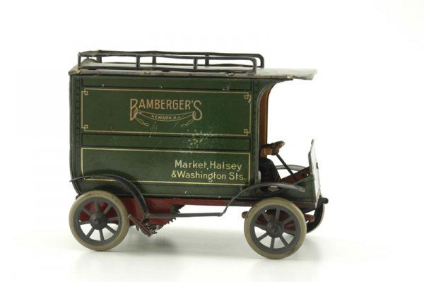 HANS EBERL "BAMBERGERS" DELIVERY VAN: Germany, c. 1930's, lithographed tin, done in green body, private label for Bamberger's of Newark, N.J., scarce example, red frame, keywind spring barrel mechanism, opening doors, seated driver. 7 1/4