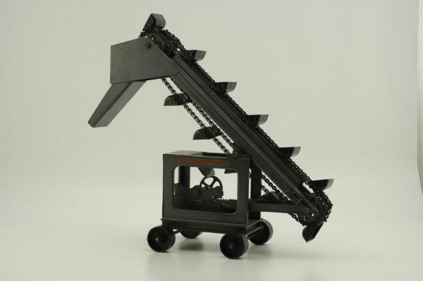 BUDDY "L" SAND LOADER: Late 1920's, pressed steel, painted in grey overall, decals on frame, cast wheels, chained bucket conveyor, front end chute, very little play wear. 17" h.