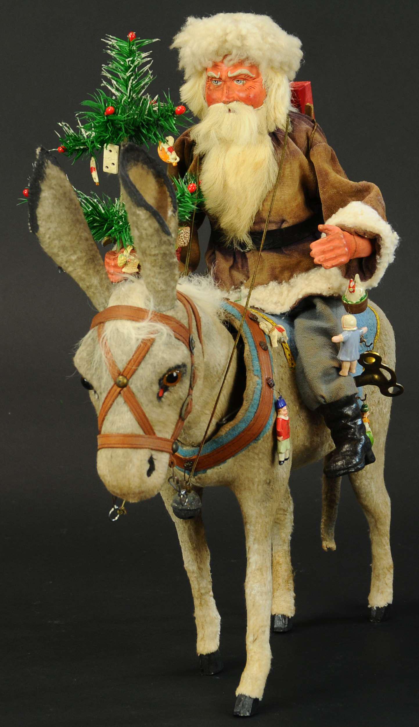 SINTER-KLAAS ON NODDING DONKEY: 239. SINTER-KLAAS ON NODDING DONKEY | This rarely seen image of Santa Claus, fur trimmed waist coat, composition hands & face w/rabbit fur beard, is riding on a delightful looking donkey w/big brown e